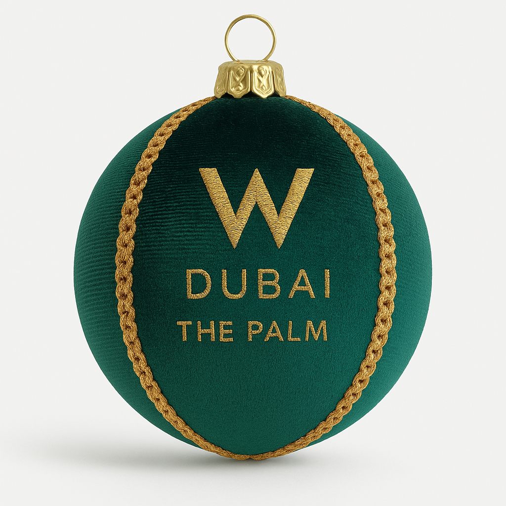 Green ornament with gold rope and 'W Dubai The Palm' text on a white background
