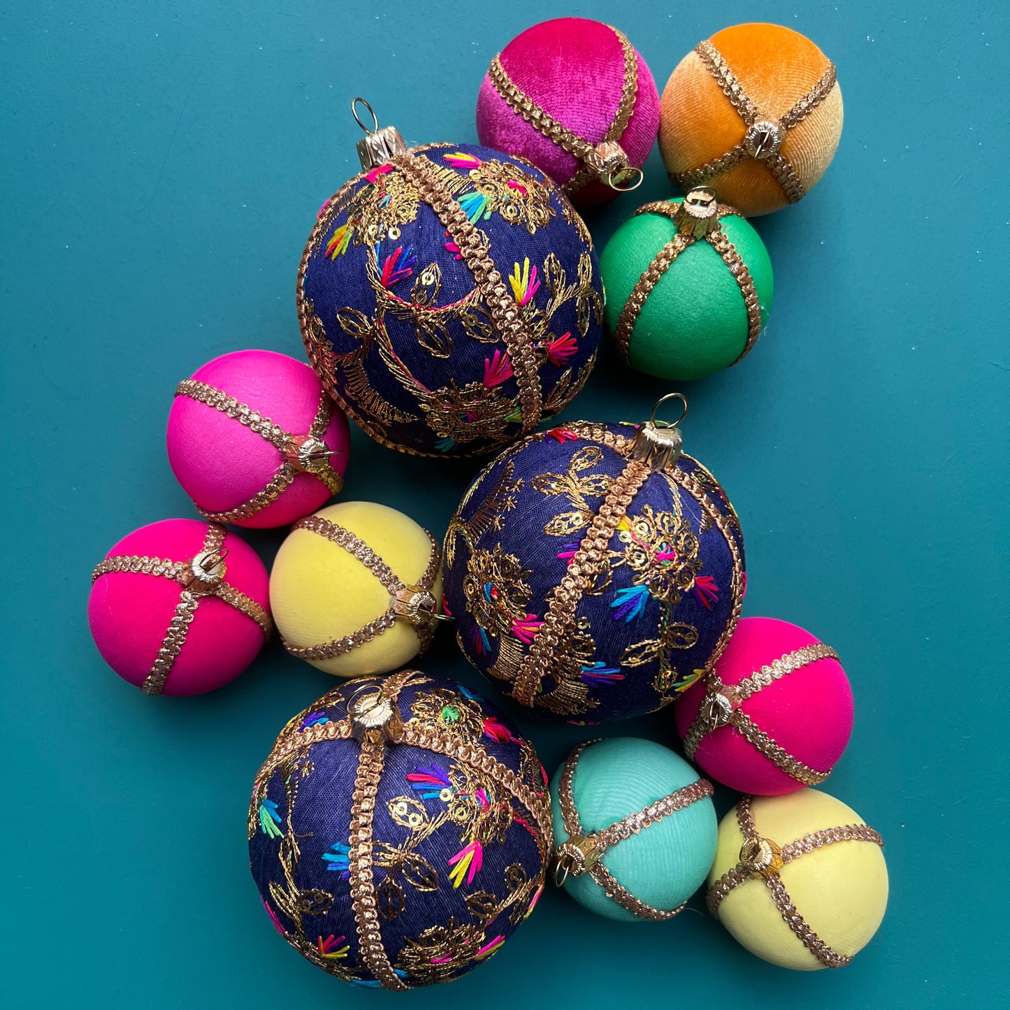 Set of Aasha deep blue handmade embroidered baubles with colourful eco-friendly decorations, sustainable festive ornaments perfect for Christmas tree styling and luxury home decor.