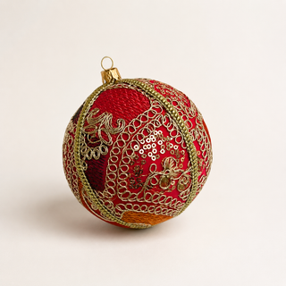 Aarna handmade fabric bauble, 10cm, hot pink ground with sweeping gold zari cord goldwork in paisley and floral forms with dense gold sequins.