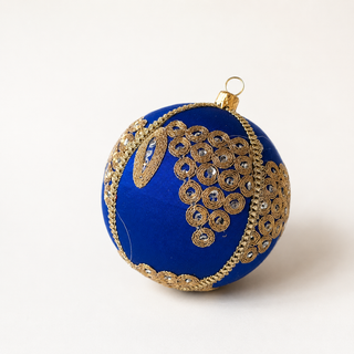 Arjun handmade fabric bauble, 10cm, royal blue ground with a cascading cluster of gold mirror-work medallions with an elongated leaf motif.