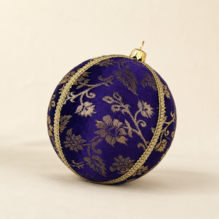 Kaasni handmade fabric bauble, 8cm, deep purple ground with sweeping gold floral scrollwork brocade with a fine cord seam trim.