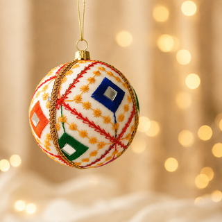 A cluster of Sohan handmade fabric baubles, 10cm, grouped to show the bold red diagonal lines with a fine gold star-stitch pattern and mirror-centred diamonds.