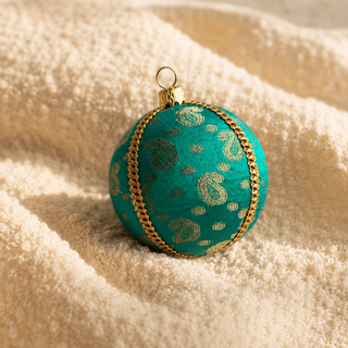 A cluster of Tarla handmade fabric baubles, 8cm, grouped to show the gold paisley motifs and delicate dotted brocade with a gold cord seam trim.