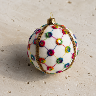 A cluster of Vikram handmade fabric baubles, 8cm, grouped to show the lattice of coloured thread with rainbow stitched circles and tiny mirror centres.