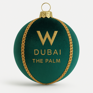 Green ornament with gold rope and 'W Dubai The Palm' text on a white background