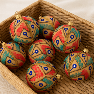 Aarav Bauble styled for event décor, sustainable handmade fabric ornament with gold trim.