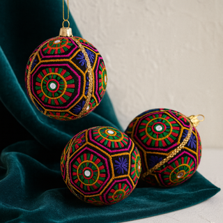 Close-up of Ananya Bauble showing gold braid, mirror accents, and geometric threadwork.