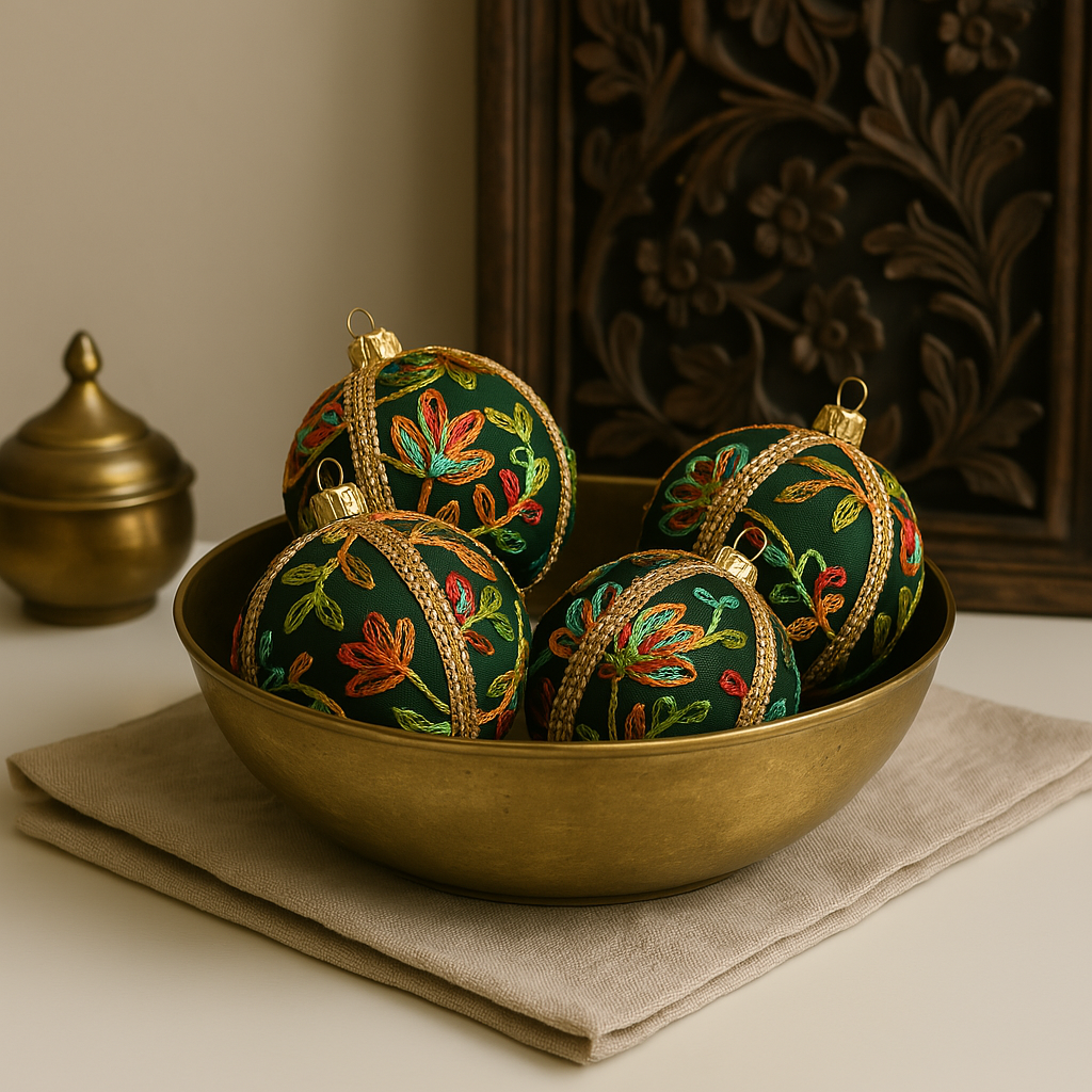 Anung Bauble – 8cm forest green fabric ornament with multicoloured botanical embroidery and gold braid, handmade in the UK.