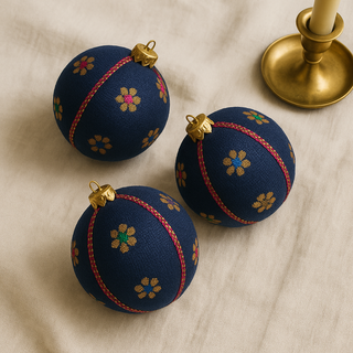 Close-up of Dancing Florals Bauble showing woven floral detail in fuchsia, blue and emerald with gold thread.