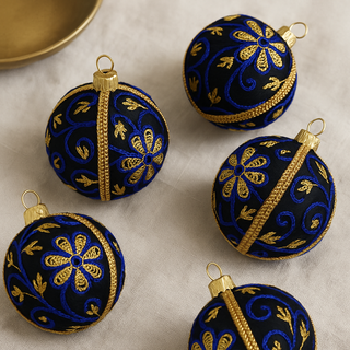Set of Ishana Baubles in black with blue and gold embroidery, luxury handmade decorations.