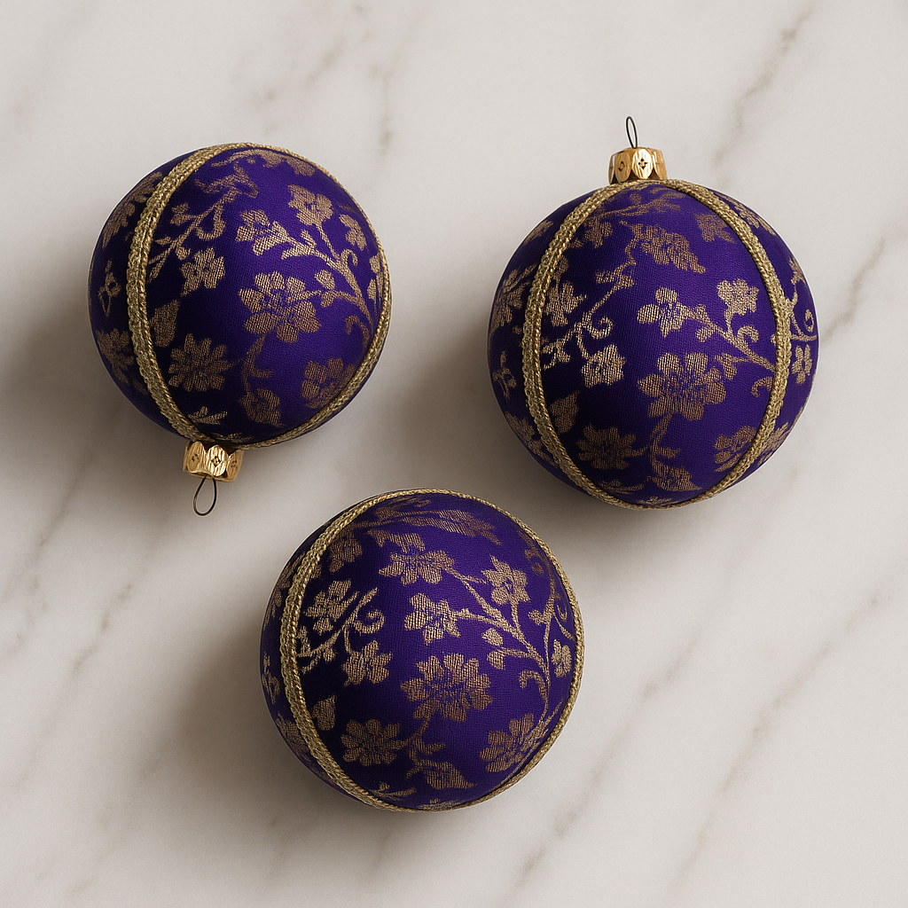Close-up of Kaasni Bauble showing gold floral brocade texture and braid trim.