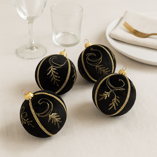 Kaia Bauble – 10cm black velvet ornament with gold sequins, thread embroidery and gold braid trim, handmade in the UK.