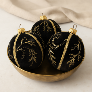 Set of Kaia Baubles in black velvet with gold embellishments, luxury handmade decorations.