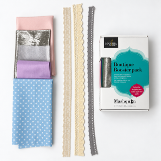 Sherbet Swirl Mashquin booster pack: blush pink, silver, white mesh, lilac and blue polka dot fabrics with lace and crochet trims beside the booster pack box