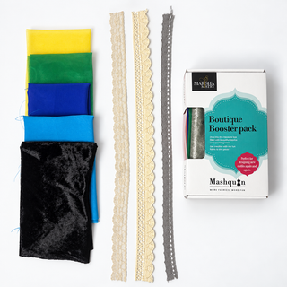 Tropical Twilight Mashquin booster pack: yellow, green, royal blue, turquoise and black crushed velvet fabrics with lace and crochet trims beside the booster pack box