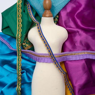 Mashquin mannequin styled with bright tropical-inspired fabrics and trims from the Tropical Twilight booster pack — perfect for sustainable fashion play.