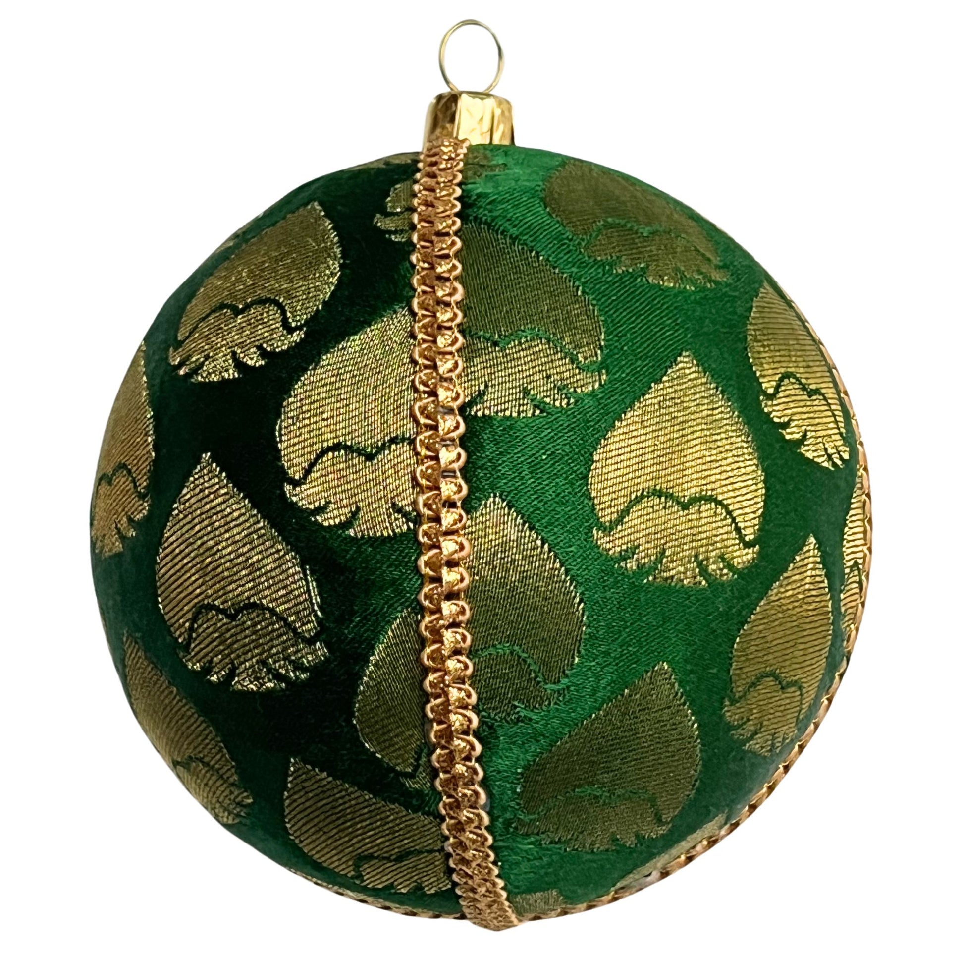 single rayansh bauble one a black background to show beauty. Rayansh Bauble – 10cm handmade fabric ornament in emerald green brocade with gold leaf motifs, luxury sustainable décor