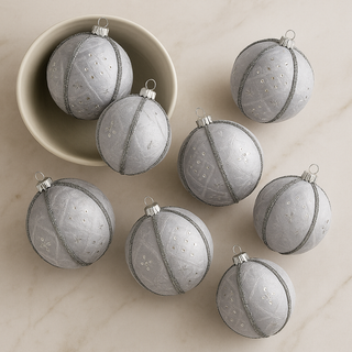 Cluster of Snow Queen baubles on a modern marble backdrop. 